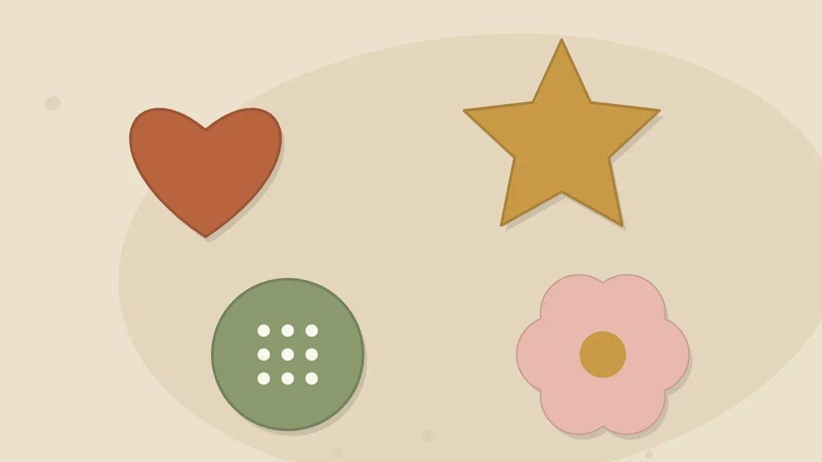 A set of small painted clay magnets in simple shapes - heart, star, circle and flower - arranged on an oat-colored surface